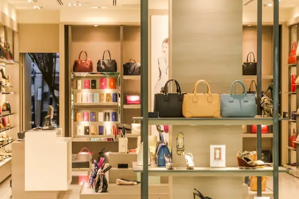 A ladies accessories store showcase displaying handbags, shoes, wallets and purses