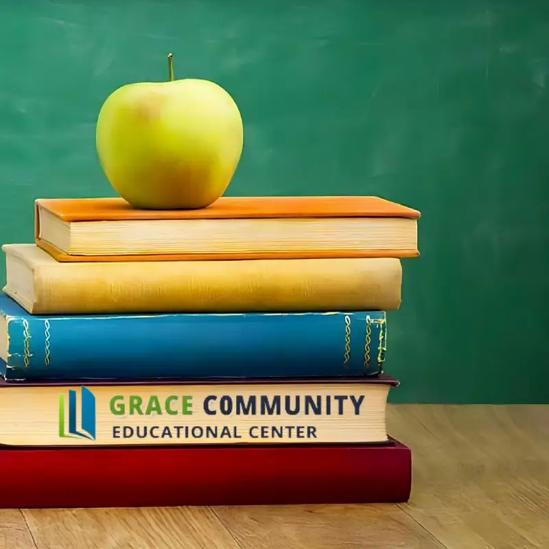 An apple on a stack of five books