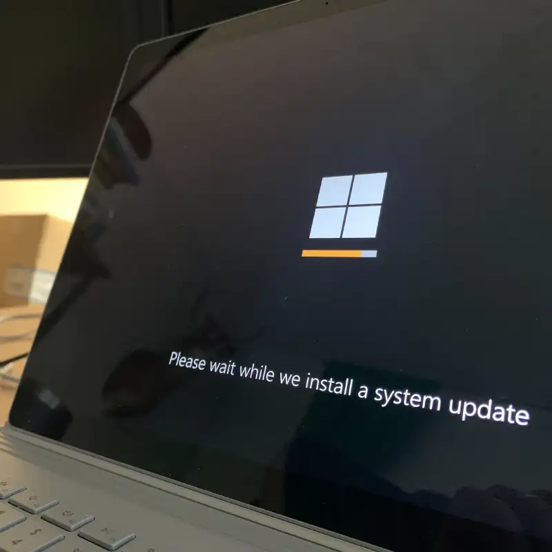 Windows operating system system update screen being displayed on a laptop representing regular website updates