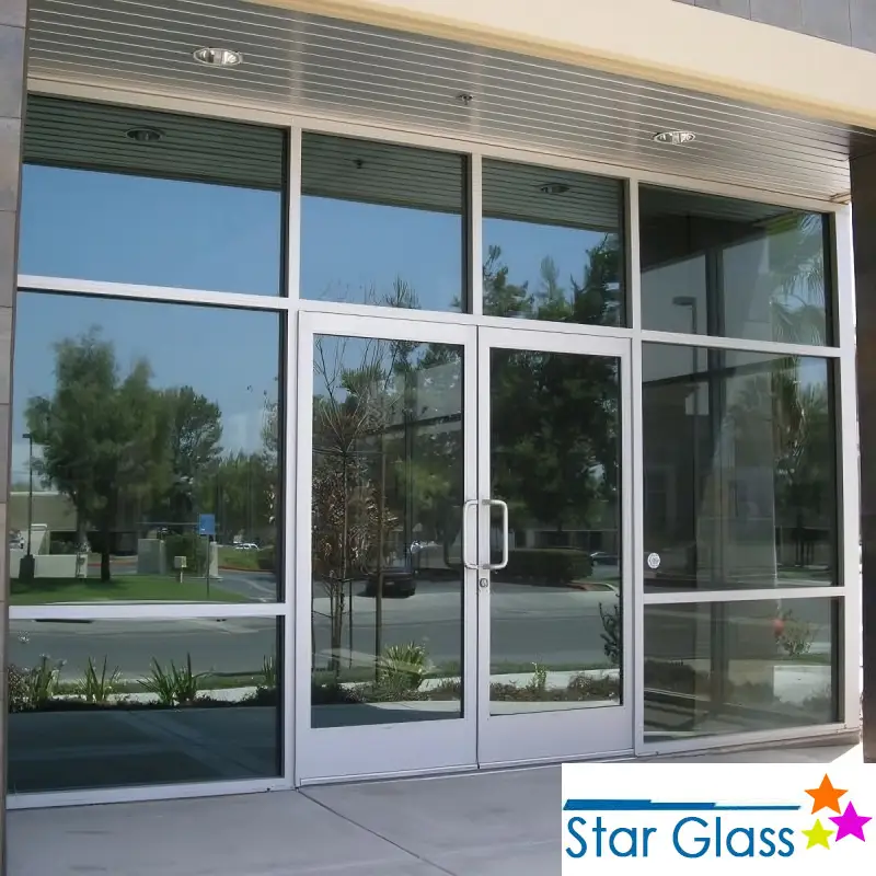 A banner for Star Glass showing an entryway covered in glass