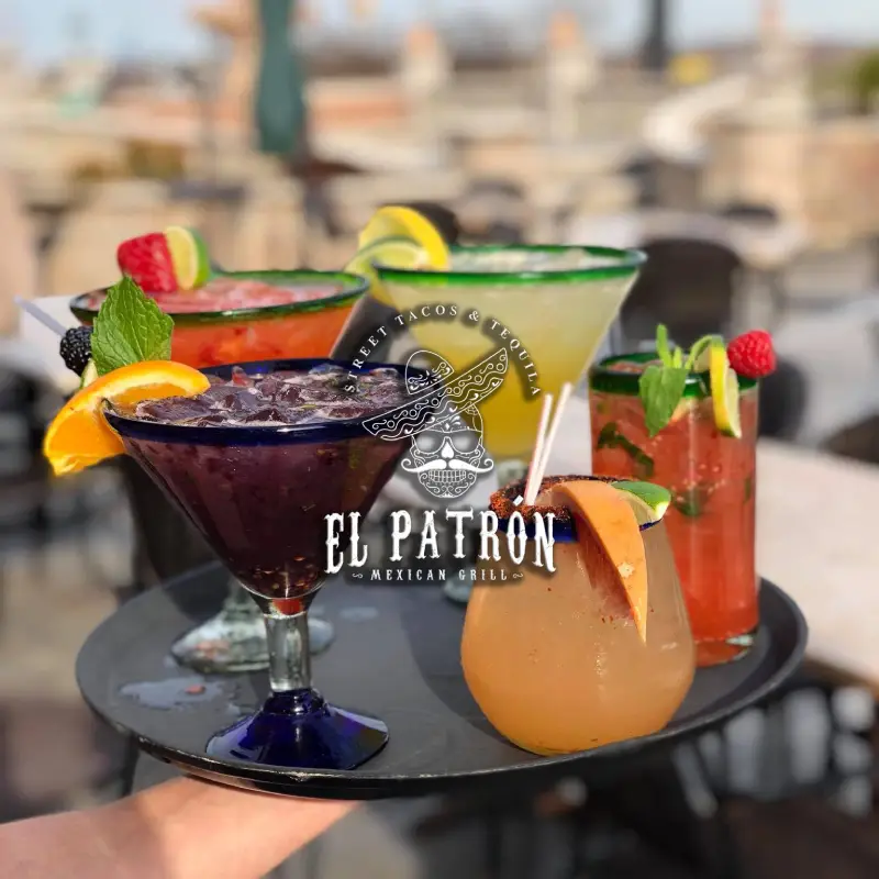 Five glasses of cocktails on a tray