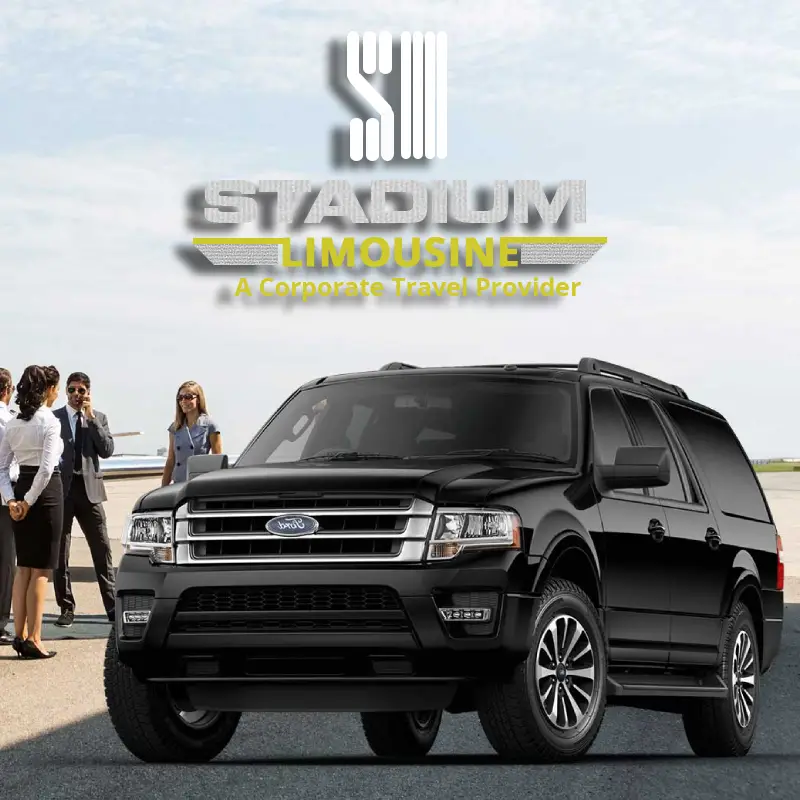 A black SUV in the foreground with people standing in the background